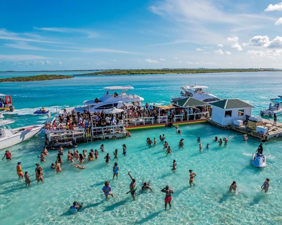 Noah’s Ark floating bar with guests enjoying the water in Turks and Caicos