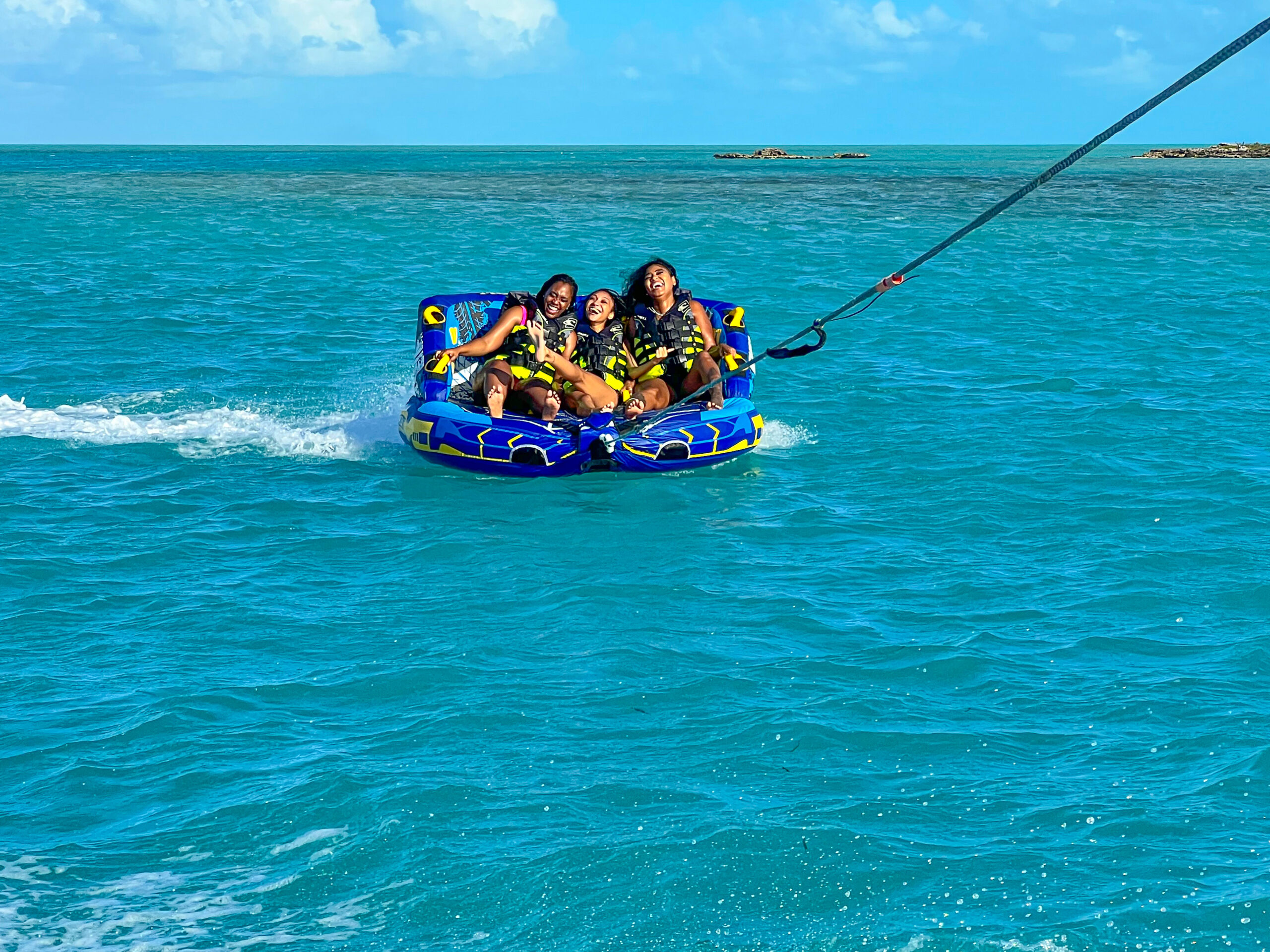 Turks and Caicos watersports – Towable tube ride on private boat charter