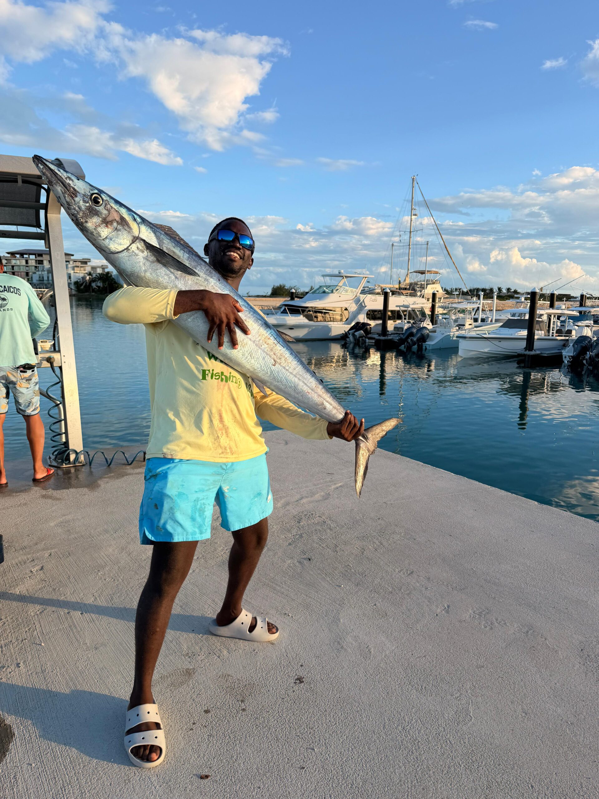 Captain with a big wahoo catch on a Turks and Caicos fishing charter