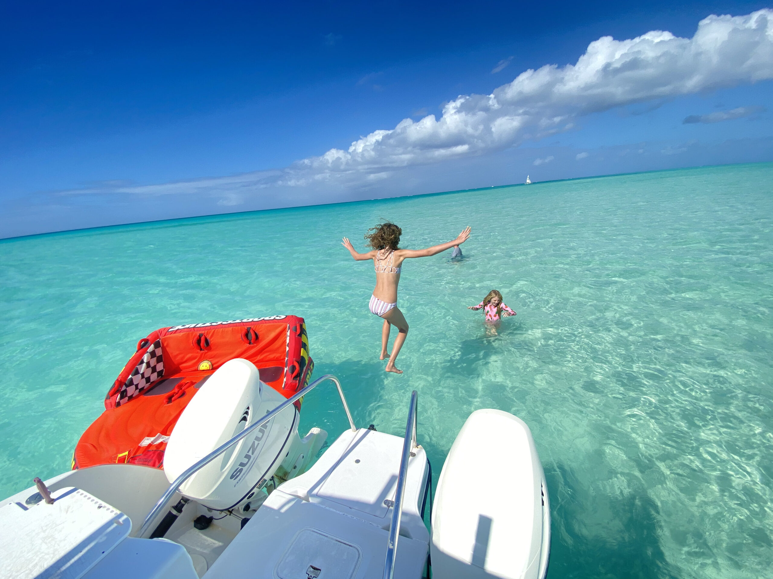 Guests enjoying watersports from a private boat in Providenciales, Turks and Caicos