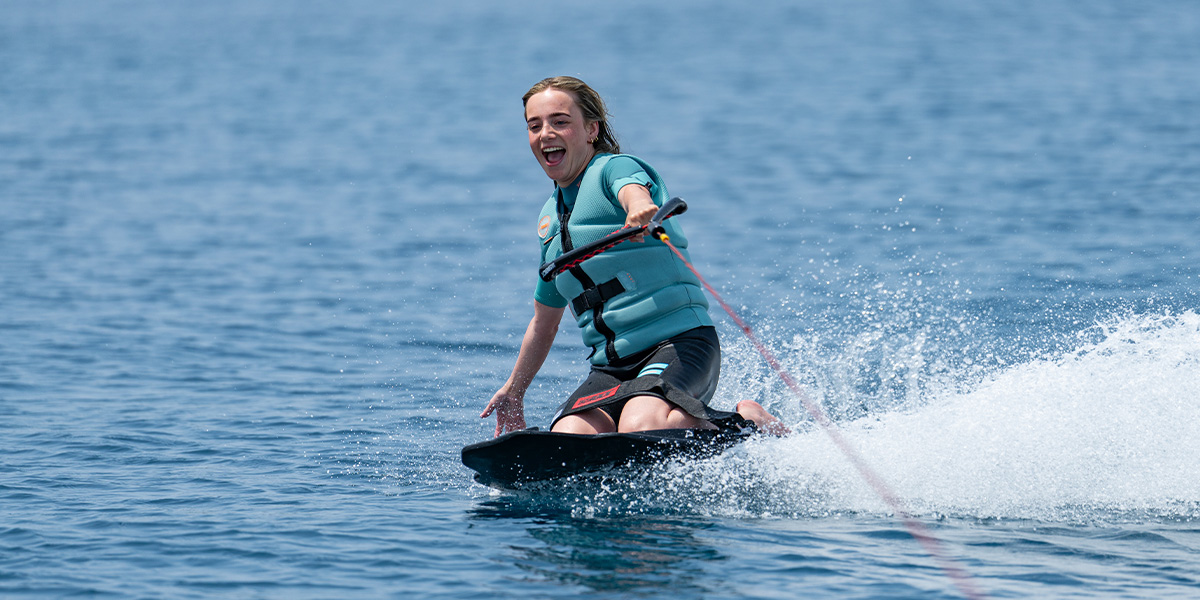Guest kneeboarding during a Turks and Caicos private charter